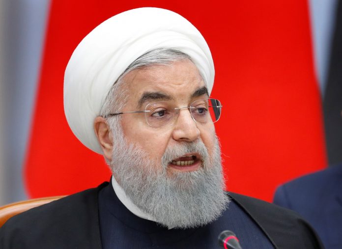 Iranian President Hassan Rouhani attends talks with Russian President Vladimir Putin and Turkish President Recep Tayyip Erdogan, during their meeting in the Black sea resort of Sochi