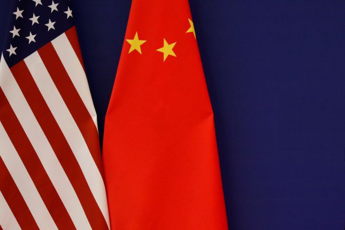 U.S. President Donald Trump delivers his speech as he and China's President Xi Jinping meet business leaders at the Great Hall of the People in Beijing