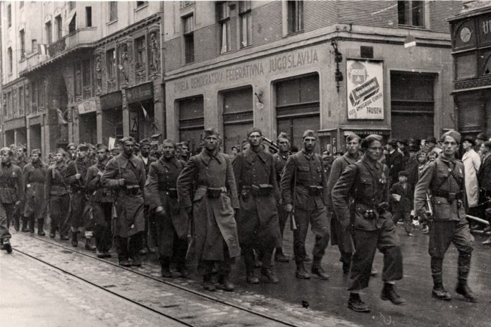 Jedinice 3. korpusa JA ulaze u oslobođeno Sarajevo 6. aprila 1945. godine.